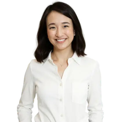 Joyce Akiko smiling, in a white button-up shirt